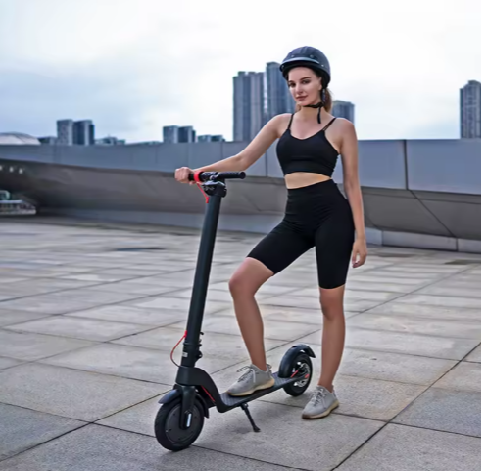 Stylish girl riding electric scooter